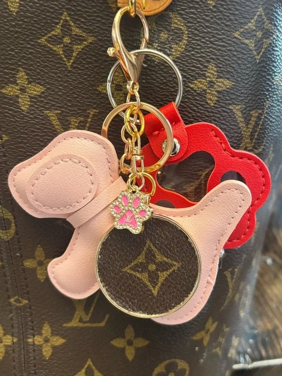 Louis Vuitton Monogram Disc,
Pink Leather Dog/Paw Bag Charm, LV charm
6.5 in. - Picture 2 of 6